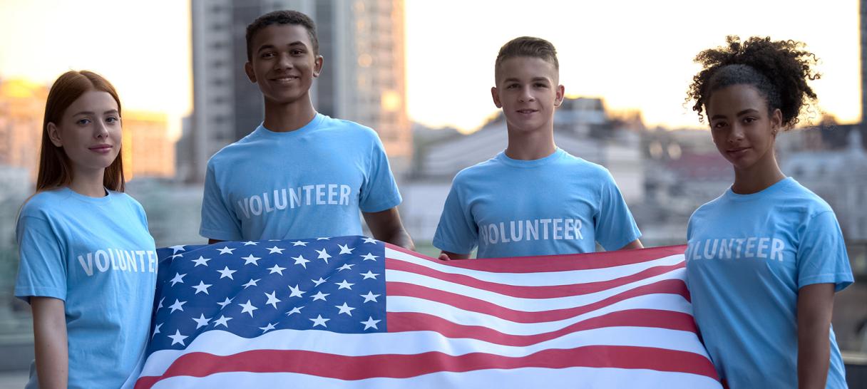 volunteers holding American flag